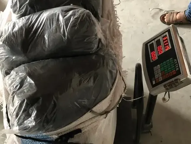 Wrapped glove bundles on a scale during a quantity check